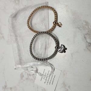 2 Braclets Silver/Gold Tone Bow Charm Bracelets